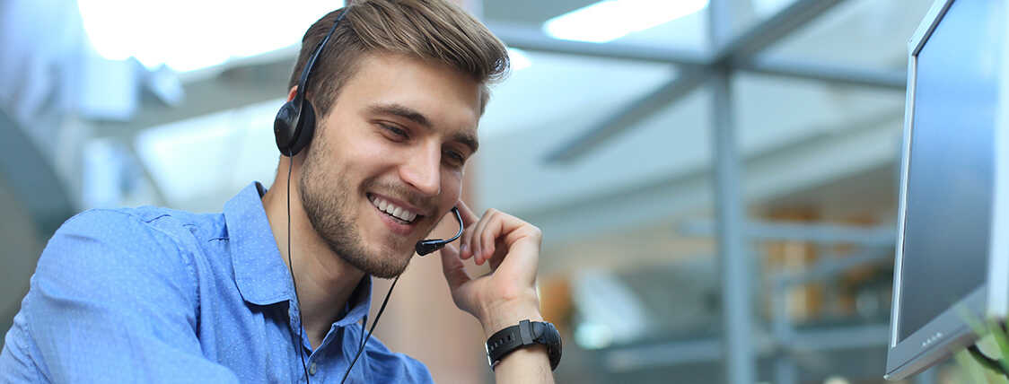 Sales person practicing solution selling on the phone with a client. 