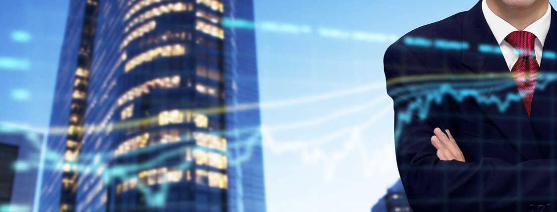 confident wealth manager standing outside a business