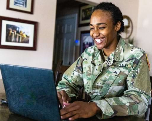 A woman from the United States Army taking a Kaplan Real Estate Education online training course